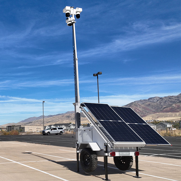 Mobile surveillance trailer with solar panels and camera mast for remote video surveillance